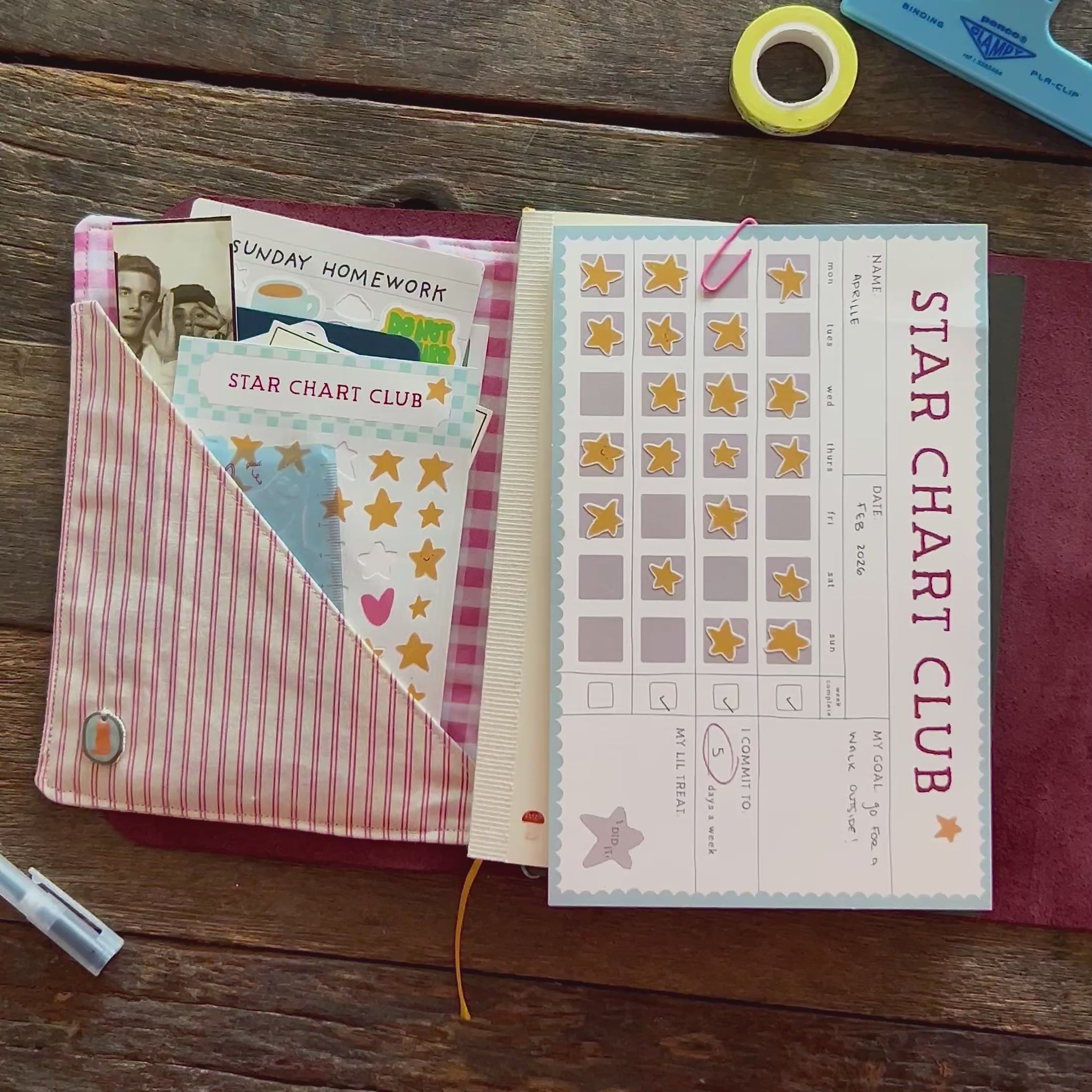 star chart club clipped into a journal with the stickers tucked into a folio.